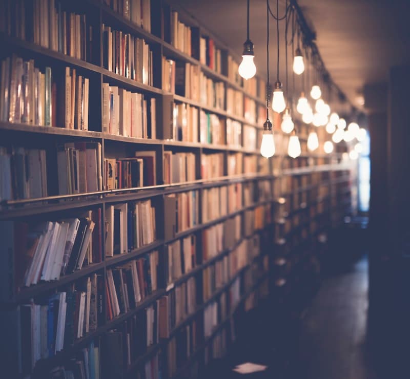 Library shelves with warm ambient lighting
